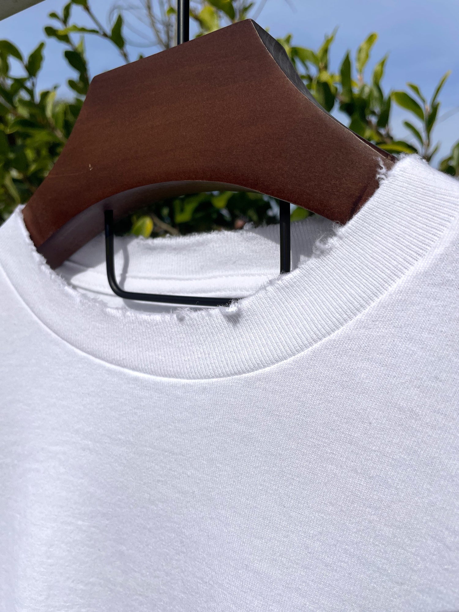Distressed ribbed neck of a white t-shirt